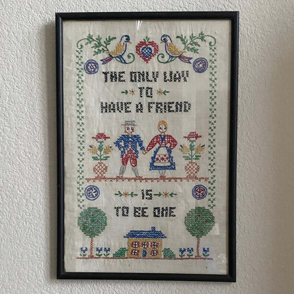 Black Framed Cross-Stitch. Vintage, hand stiched quote done in folk art style.